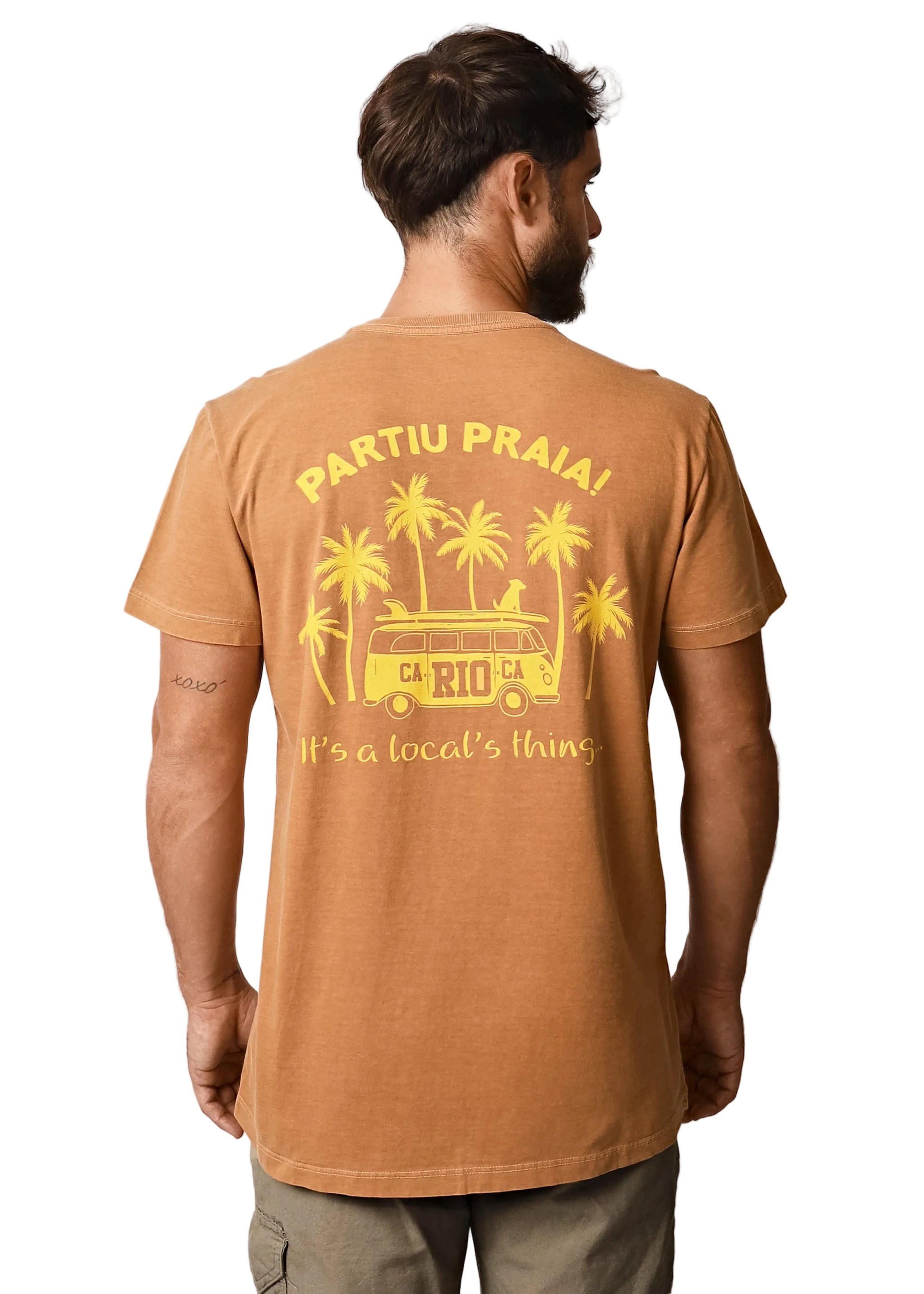 Man wearing a brown t-shirt with yellow graphic and text on a white background