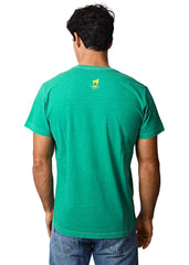 Person wearing a green t-shirt with a yellow logo on the back against a white background