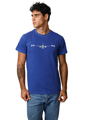 Man wearing a blue t-shirt with a graphic design on a white background