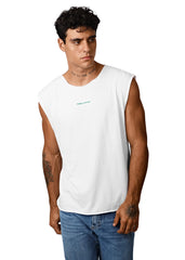 Man wearing a white sleeveless shirt with text on a plain background