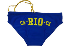 A royal blue swim cap with yellow 'CA-RIO-C.A' lettering and yellow ear loops, laid flat on a white surface.